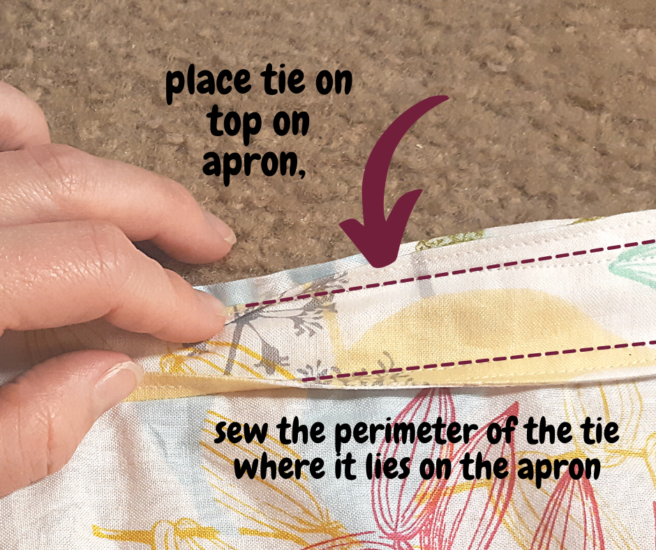 hand on floral fabric showing where to sew the tie