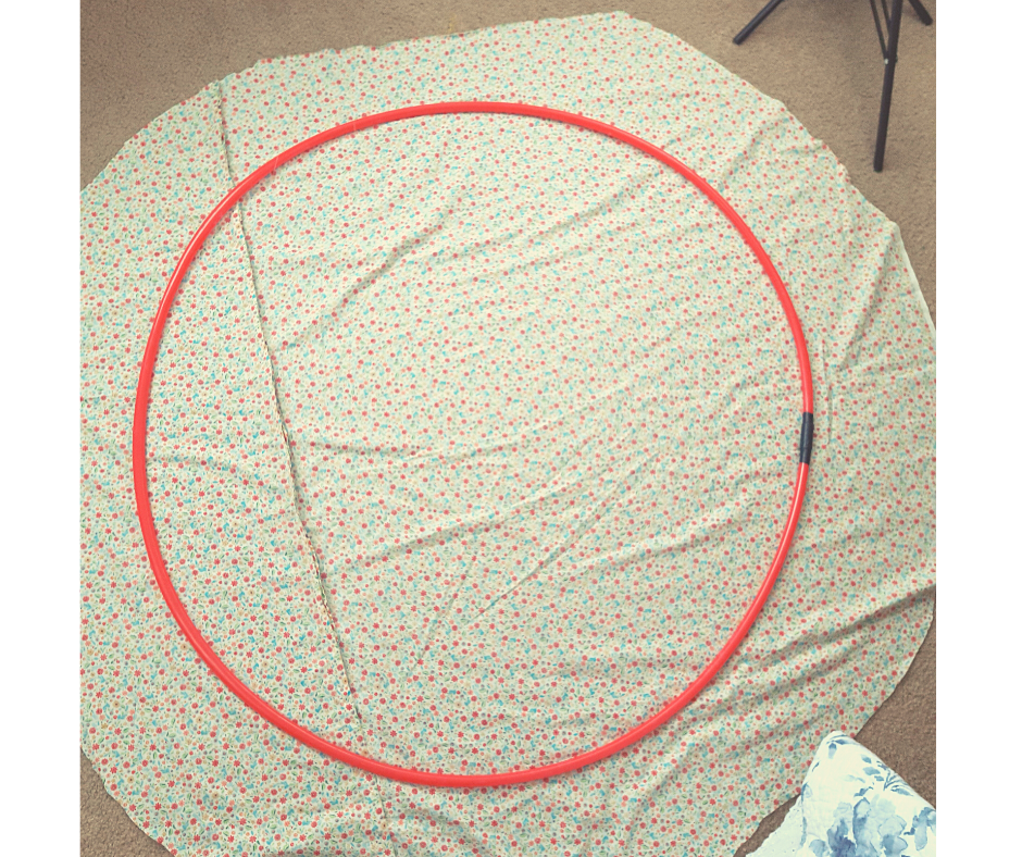 red circle of tubing on floral fabric 