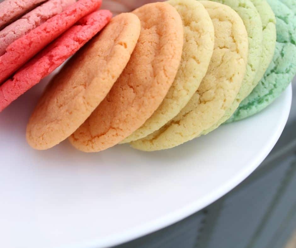 rainbow sugar cookies on a white plate