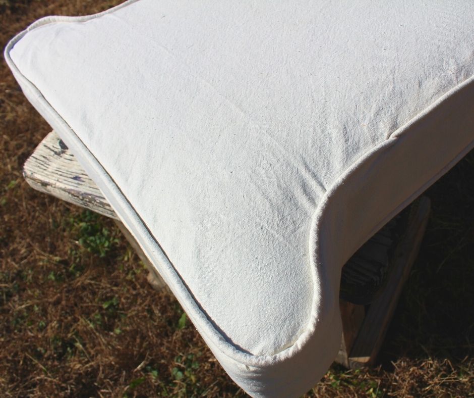 cushion cover made out of drop cloth, outside on a table