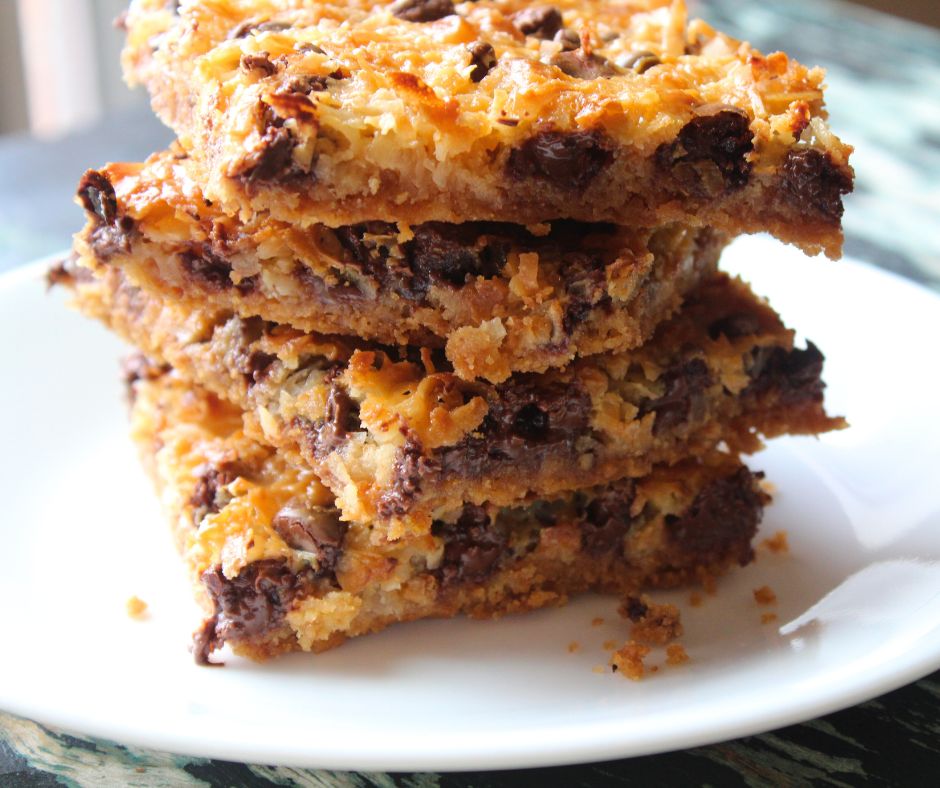 magic bars in a stack on a white plate