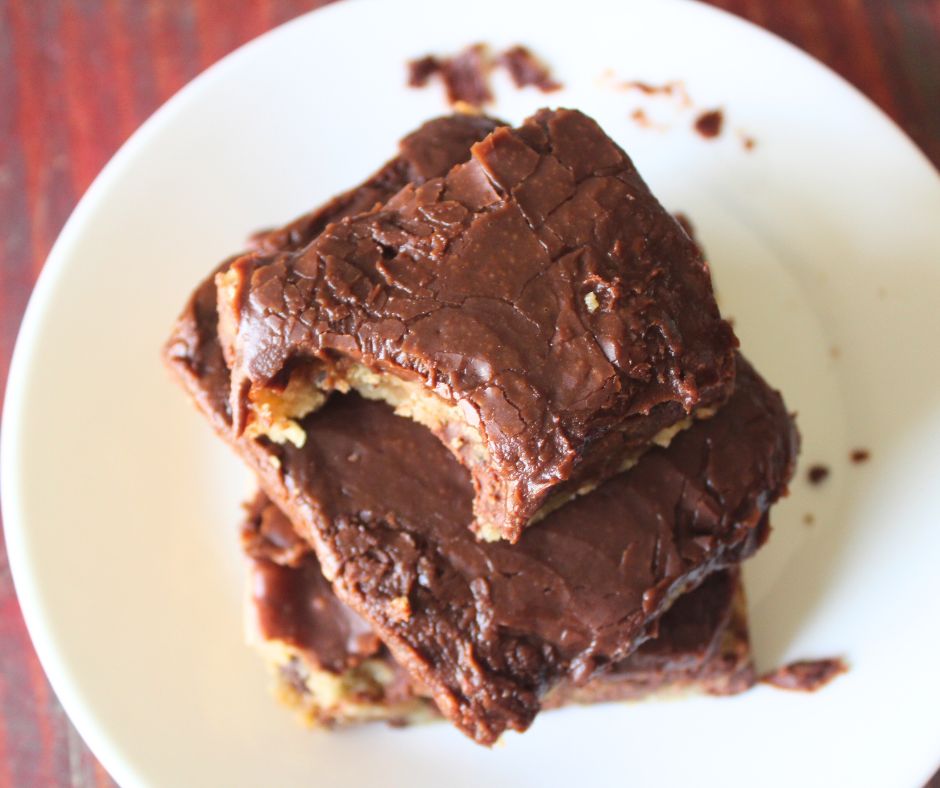 chocolate chip cookie bars stacked with a bite taken out from the top